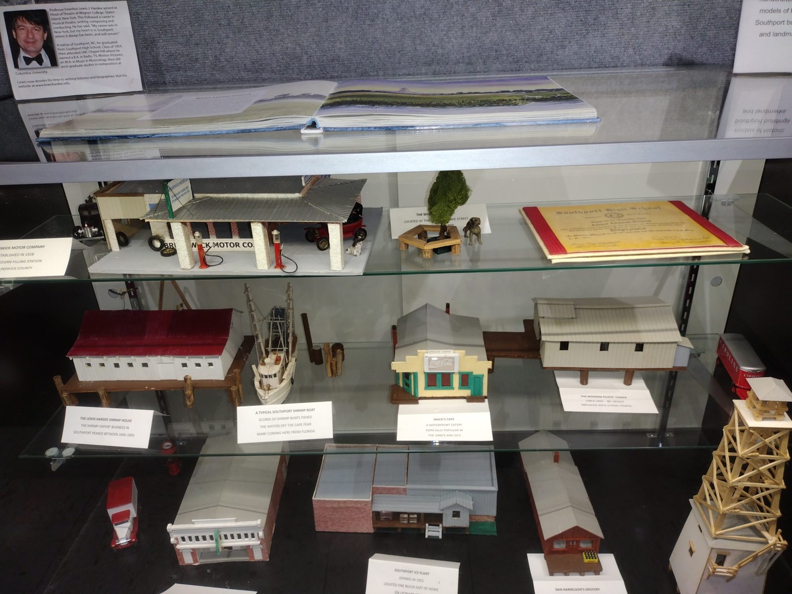 Display case with model buildings and documents
