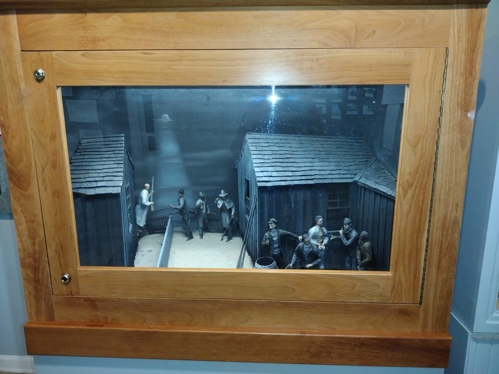 Framed historic street scene in a wooden case