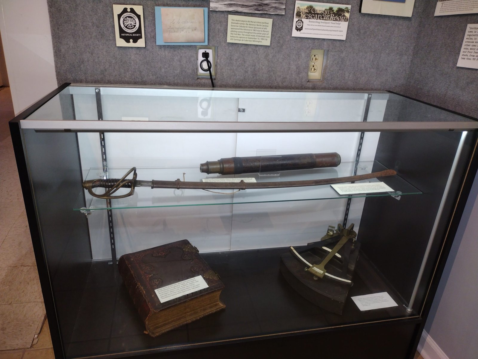 Glass case with antique tools