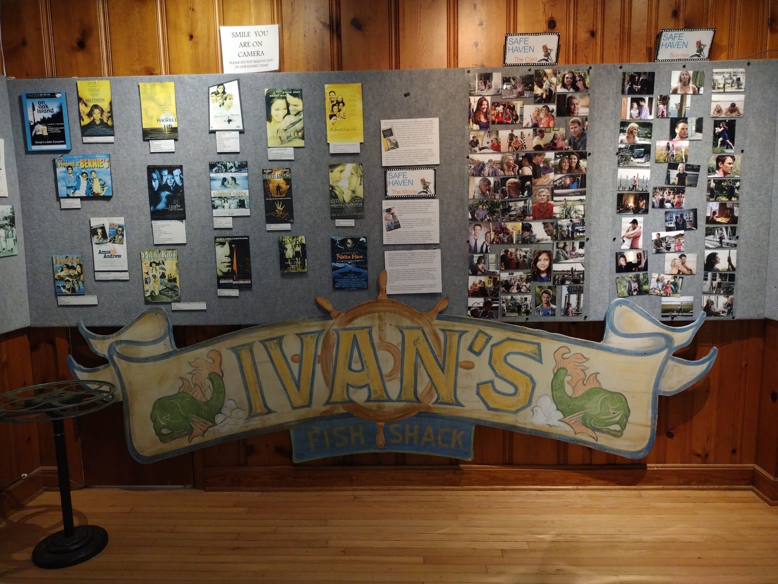 Ivan’s sign with photo collage wall